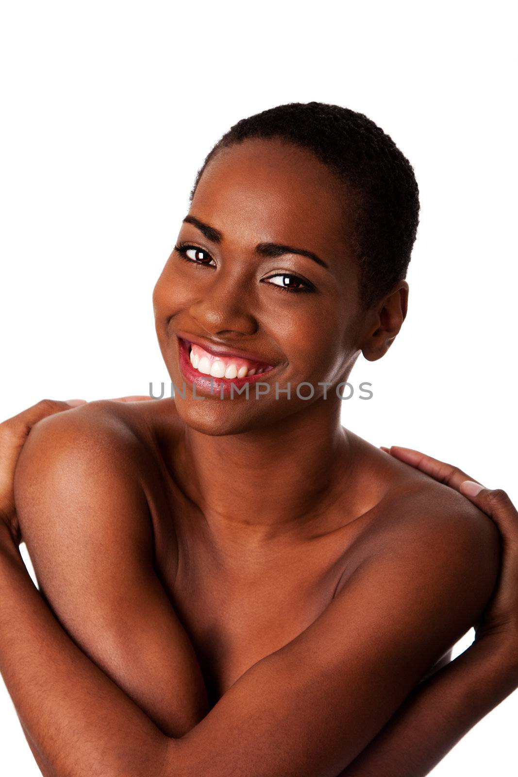 Happy smiling beautiful African woman hugging herself as an inspiration, isolated.