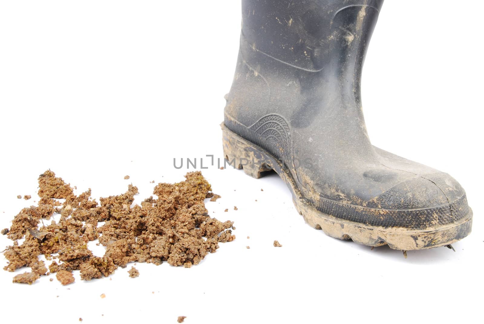 one muddy farmer boot isolated on a white background