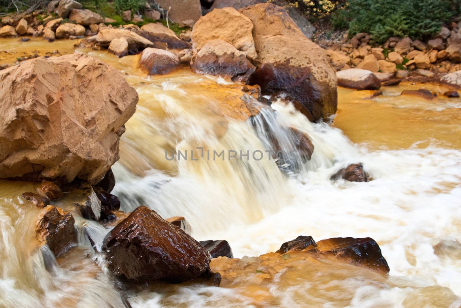 Yellow river in Colorado mountains