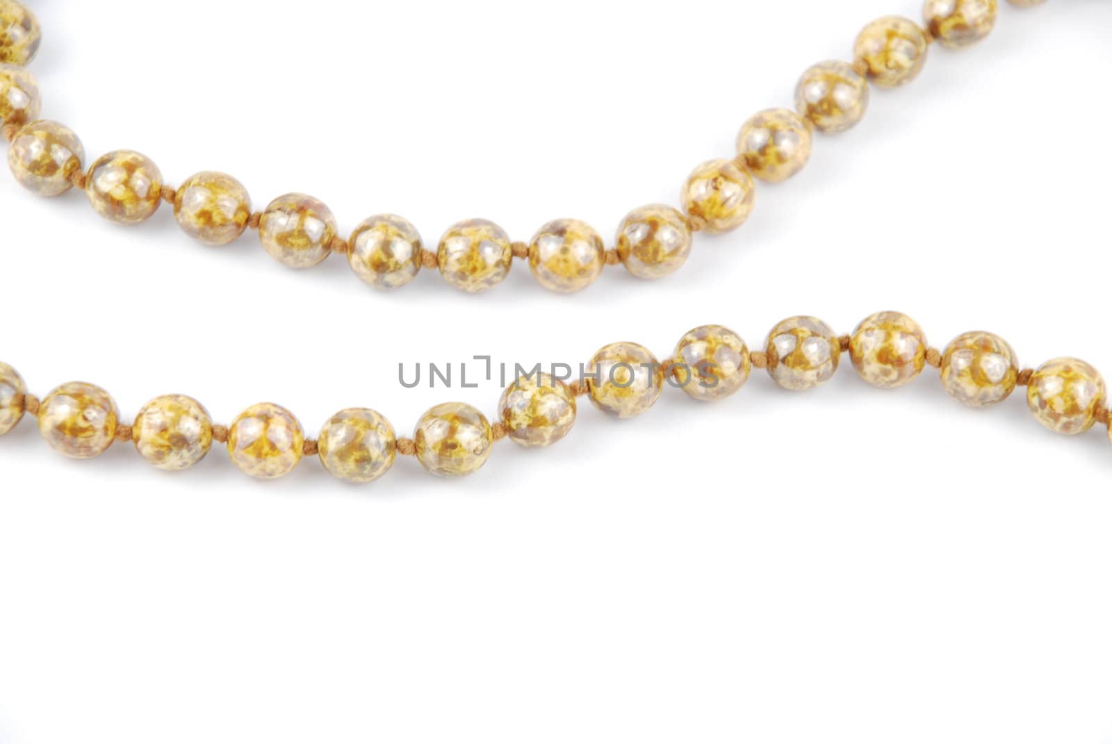 close-up on pearl necklace isolated on a white background
