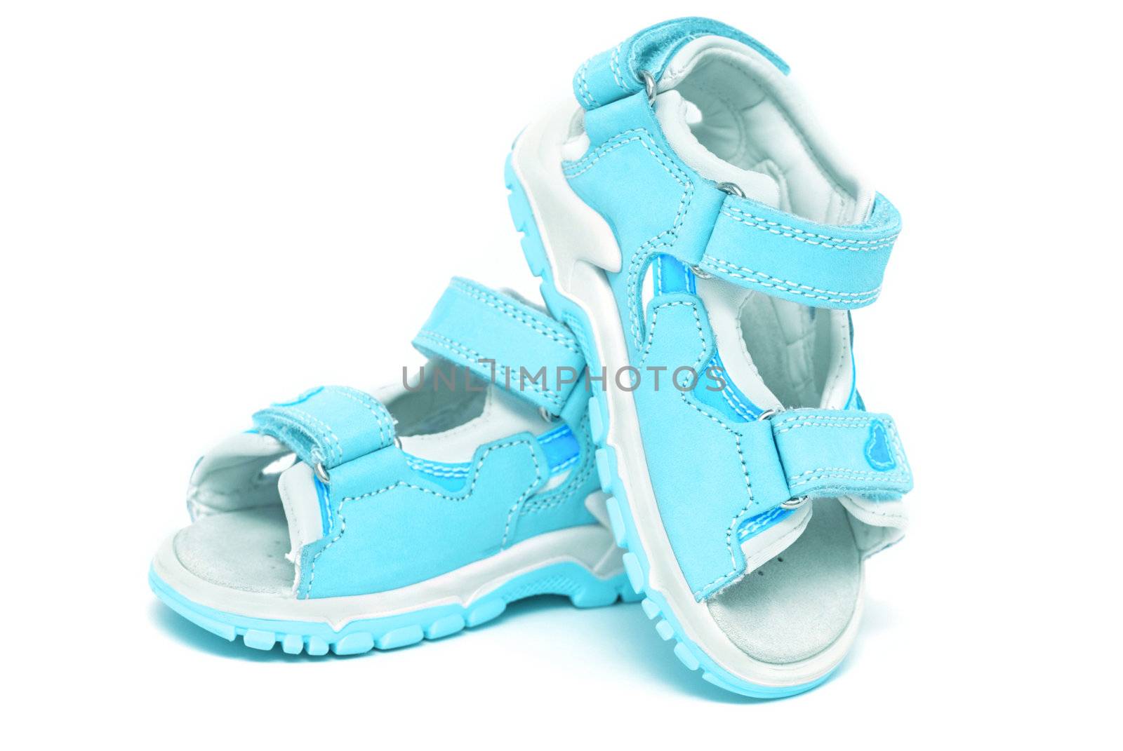 Blue child's sandals isolated on white