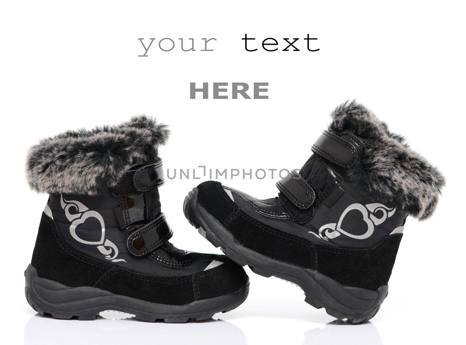 Black child's winter boots isolated on white background (with space for text)