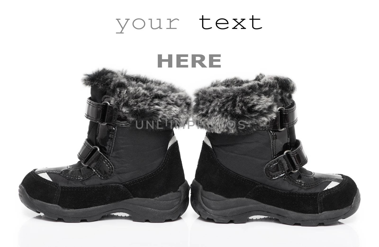 Black child's winter boots isolated on white background (with space for text)