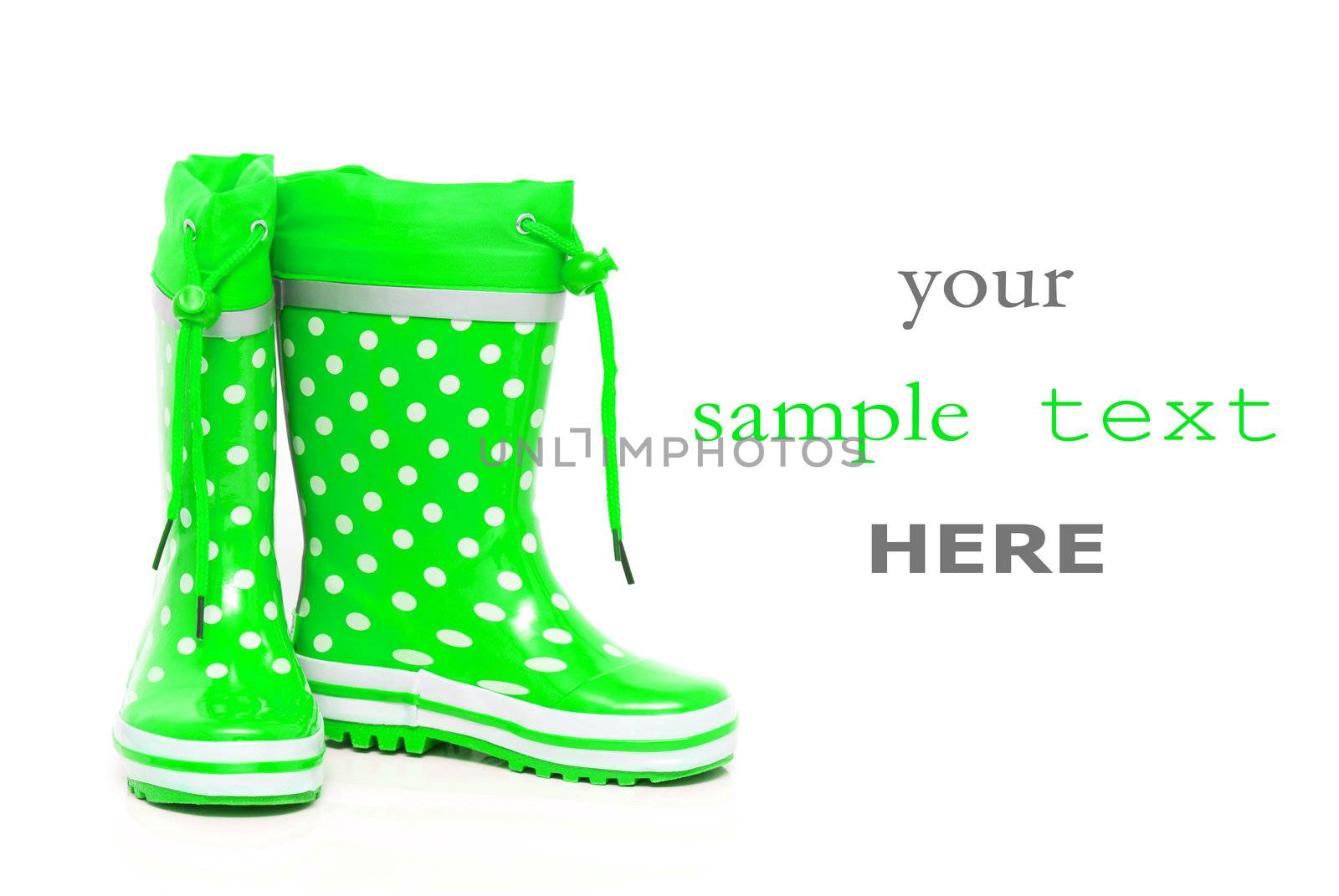 Green rubber boots for kids isolated on white background (with space for text)