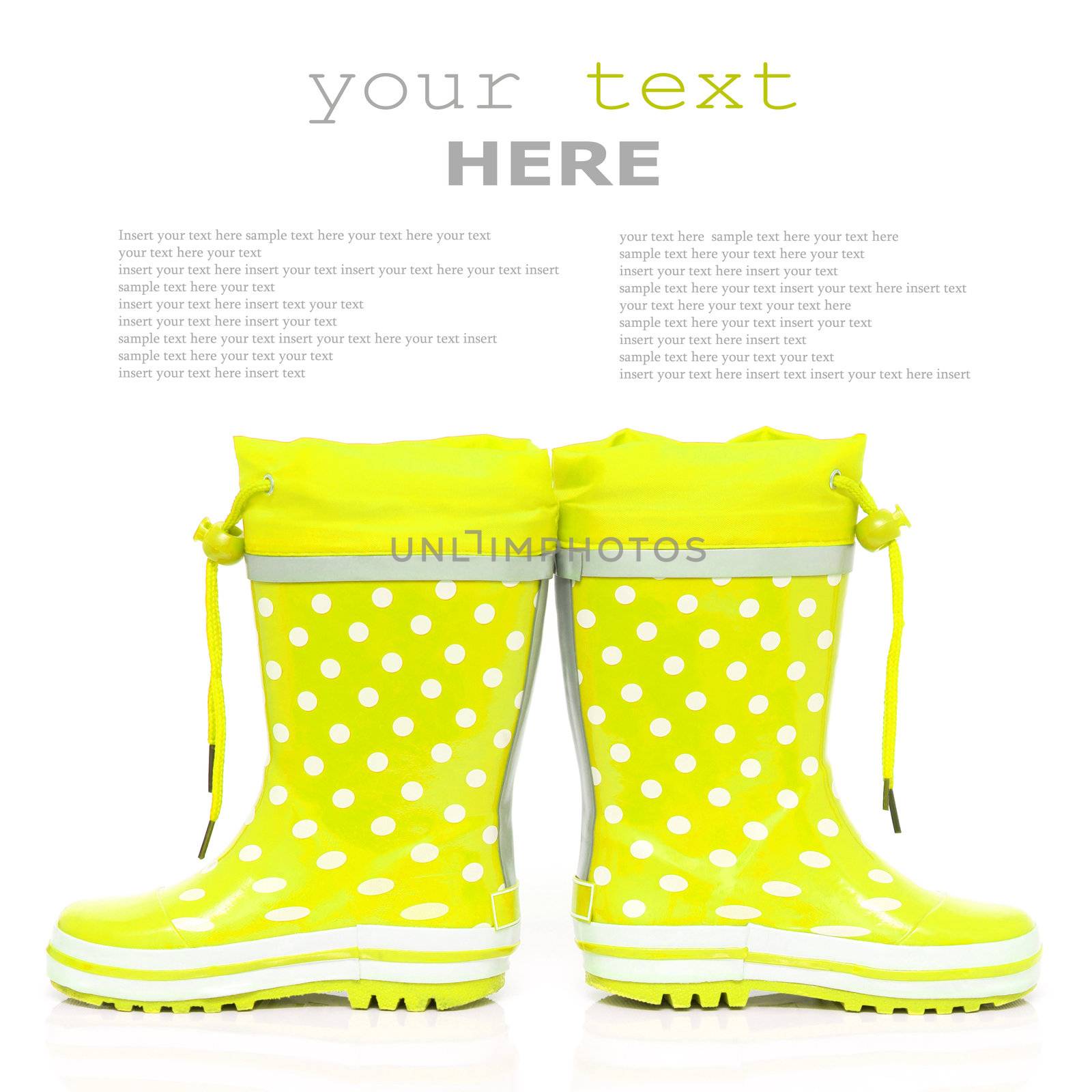 Yellow rubber boots for kids isolated on white background (with sample text)