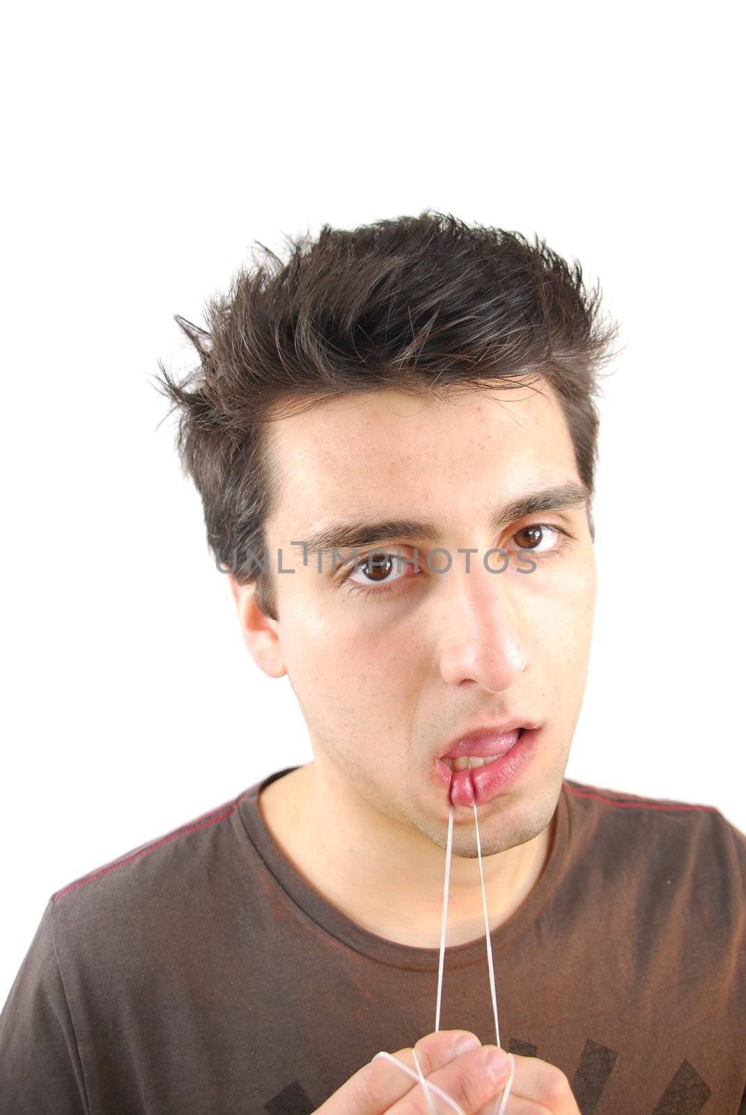 young man flossing his teeth isolated on white background