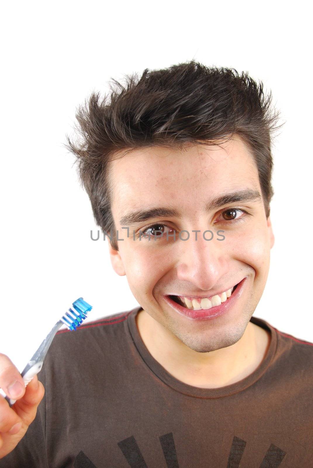 cheerful young man is washing teeth over white background
