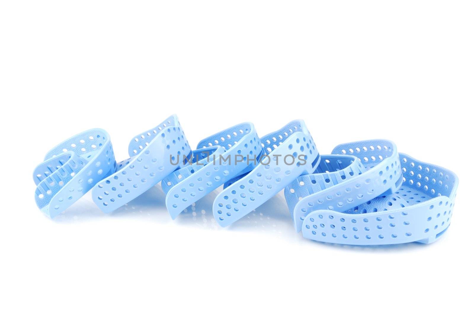 different sizes of acrylic trays for teeth impressions