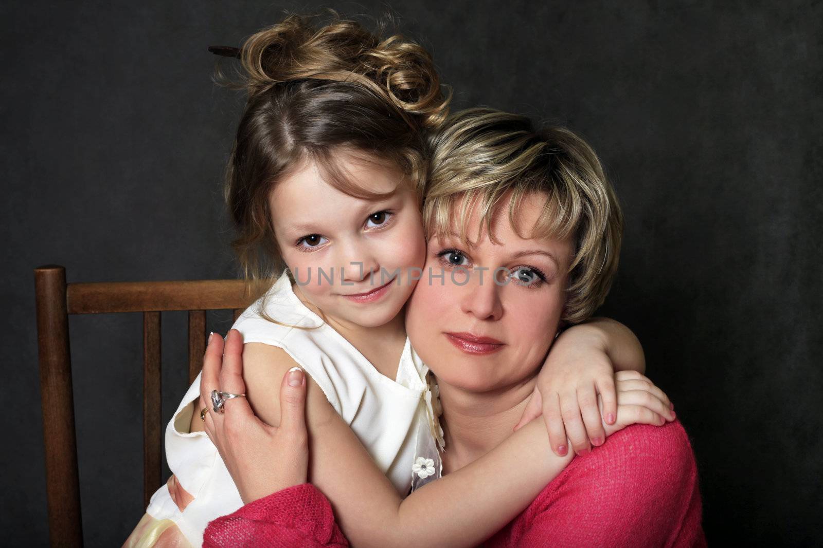 Portrait mum with a daughter in studio
