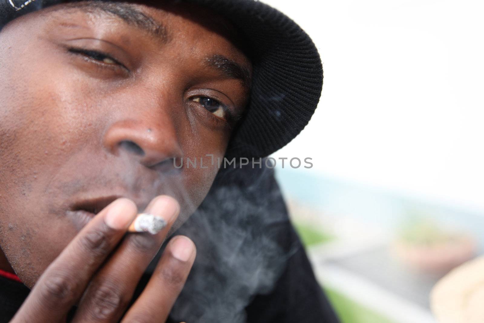 Portrait of a young African-Americans with cigarette
