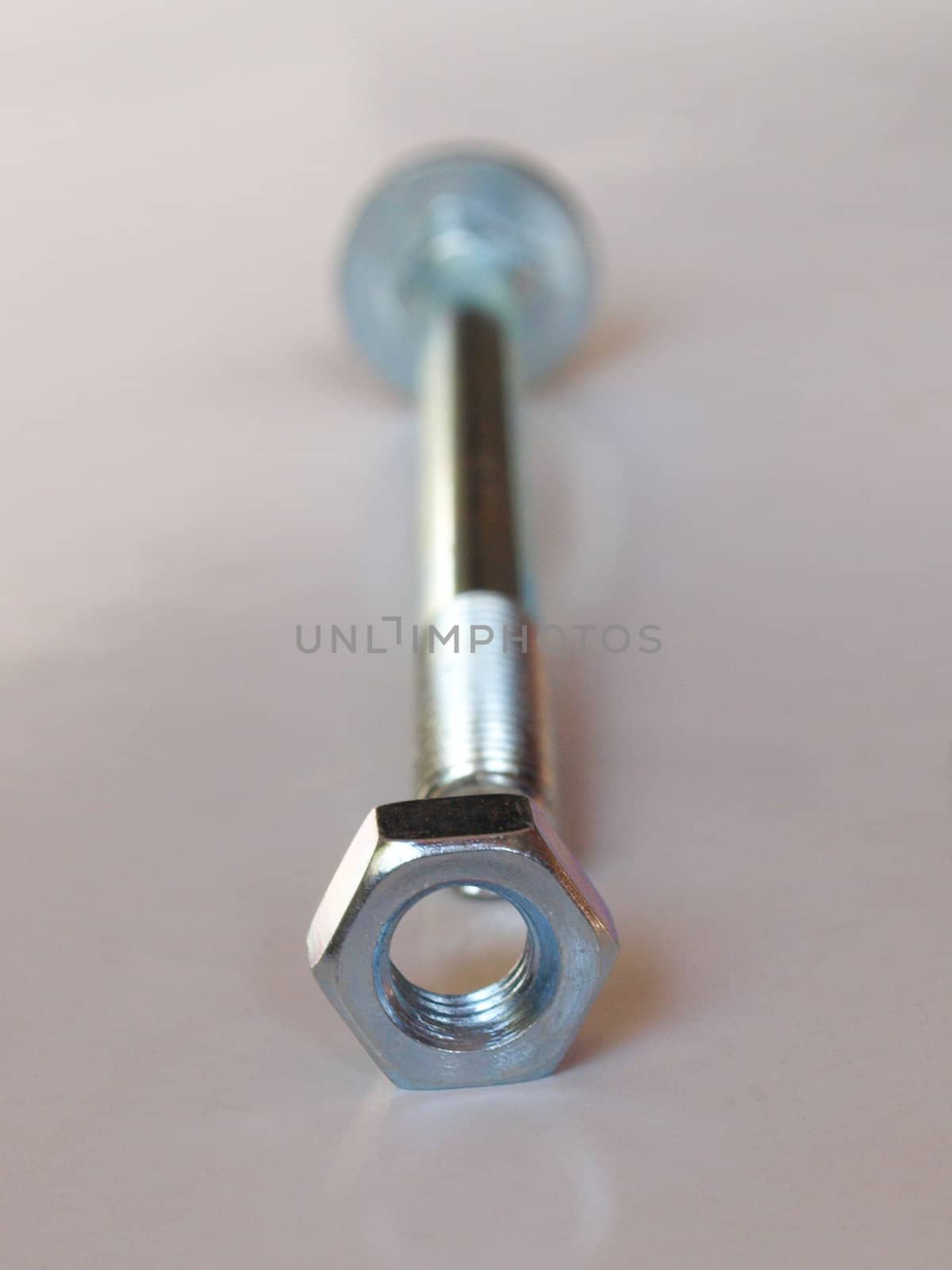 Industrial steel hardware bolt nut screw washer - selective focus