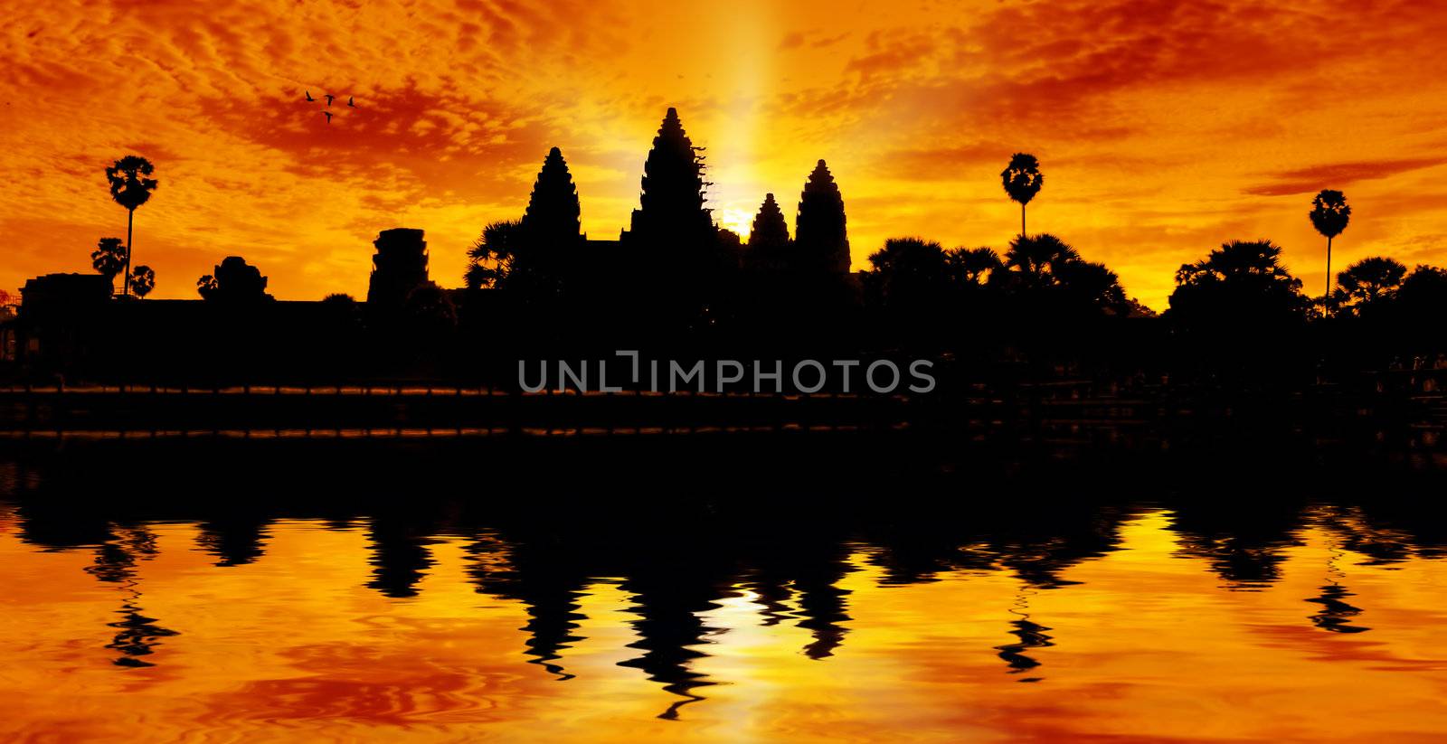 Silhouette of Angor Wat temple in the sunrise