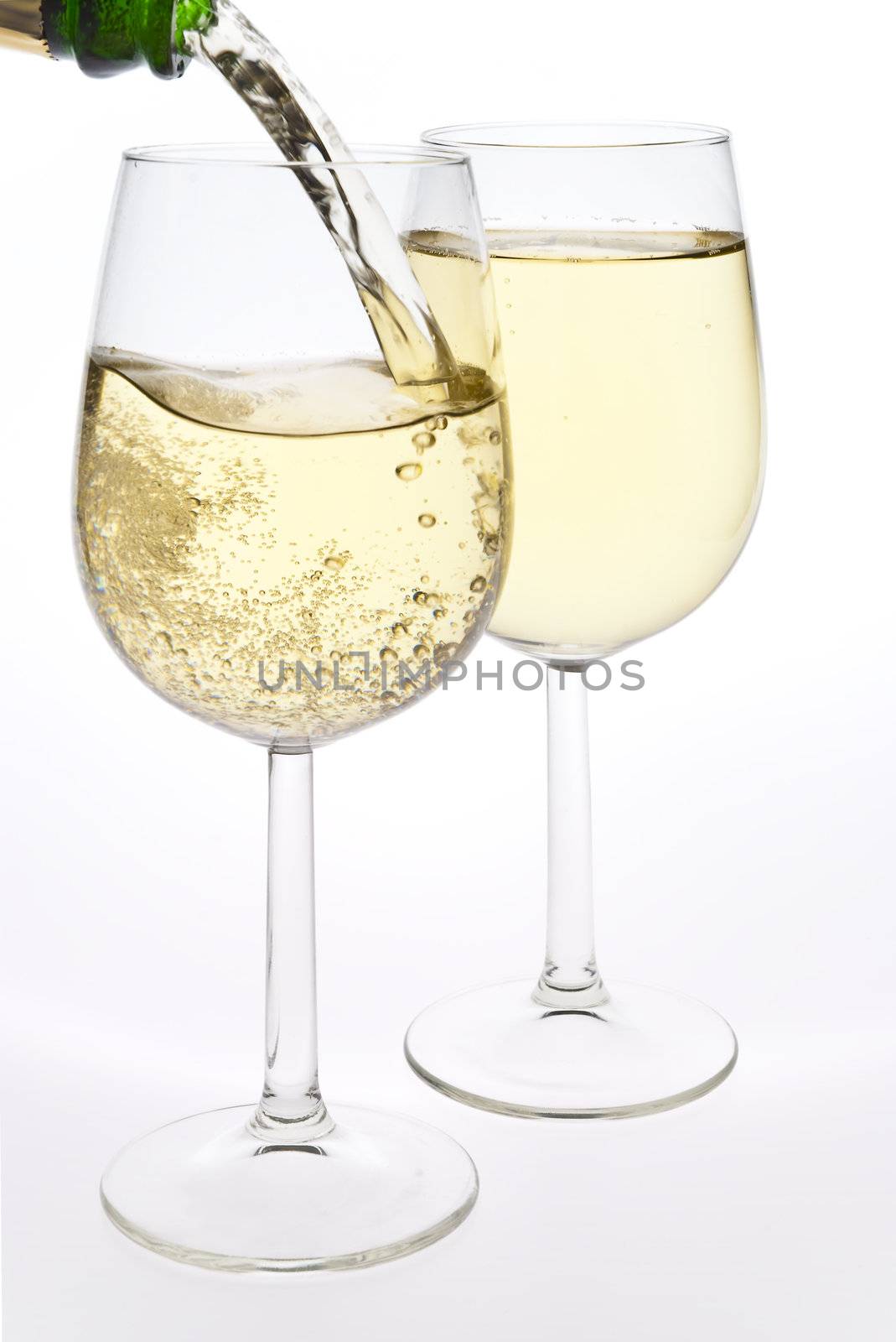 Merry Christmas and happy New year. Pair of champagne flutes making a toast, isolated on white background.