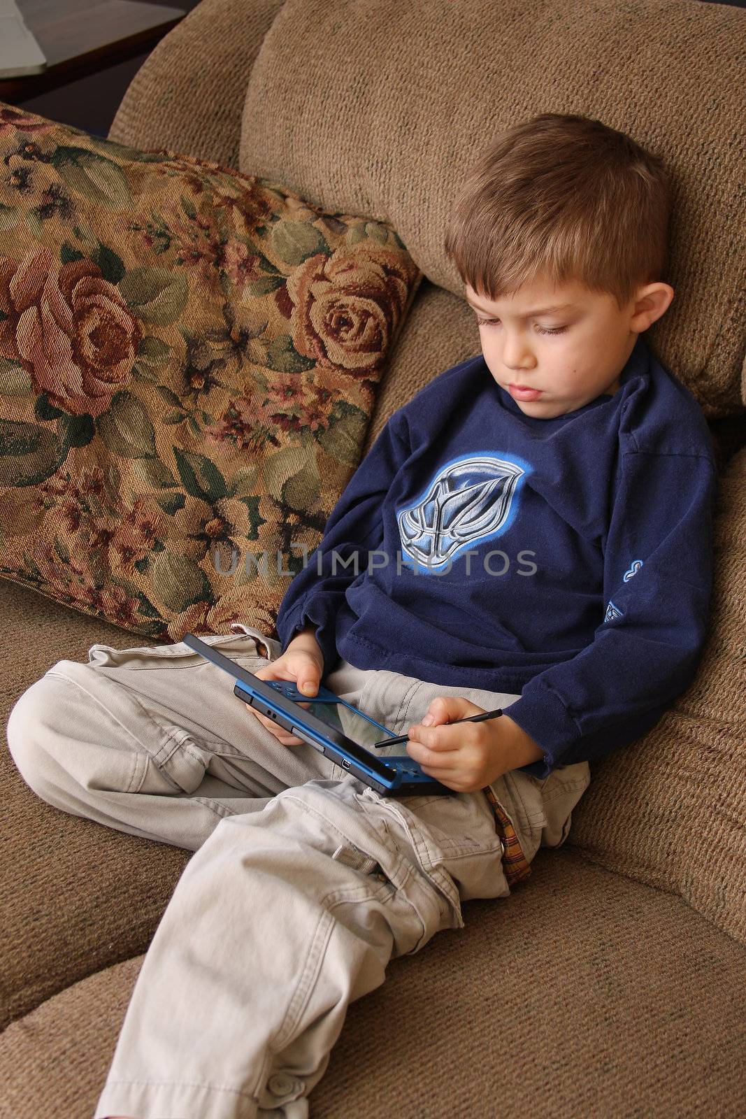A little boy playing a video game.
