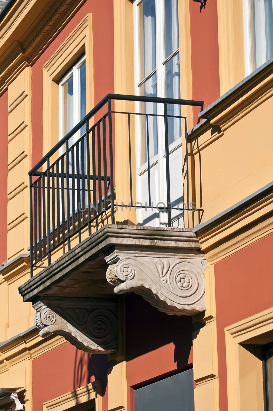 Detail of balcony in colorful house facade.