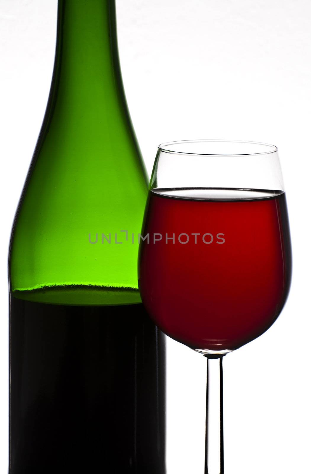Bottle and glass of red wine isolated on white background by mozzyb