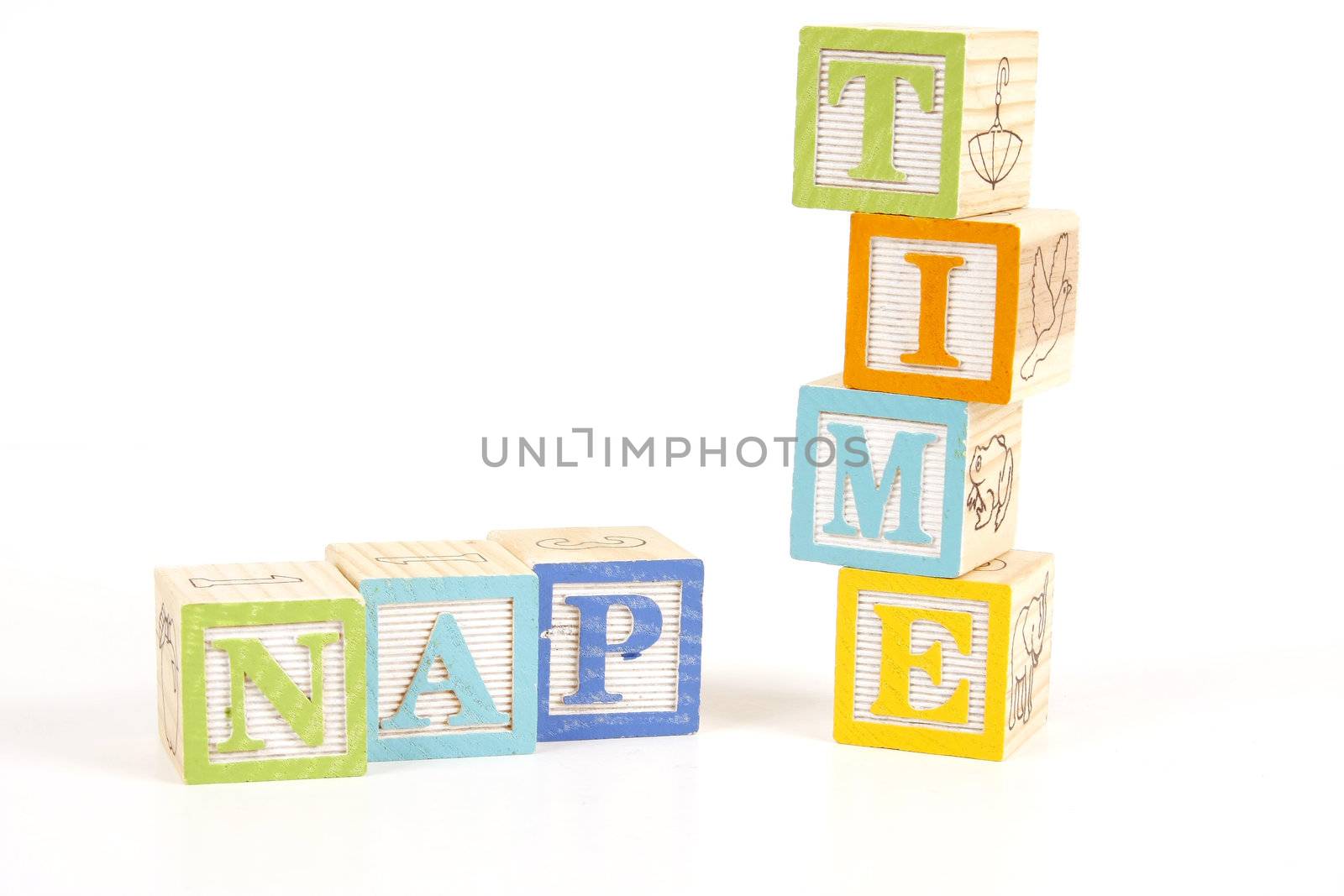 Colorful childrens blocks spell the words nap time.