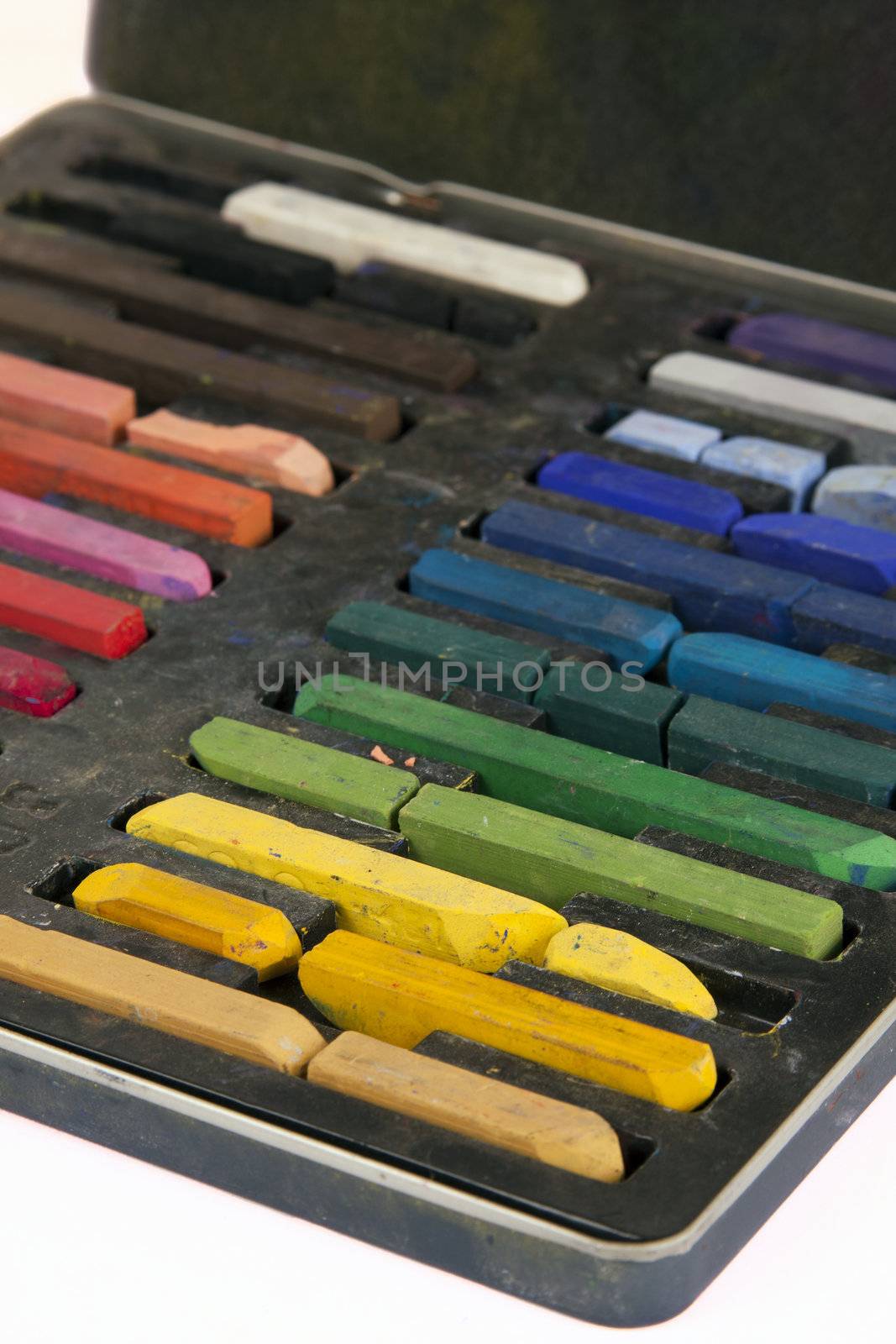 Artistic chalk in its case in color order.