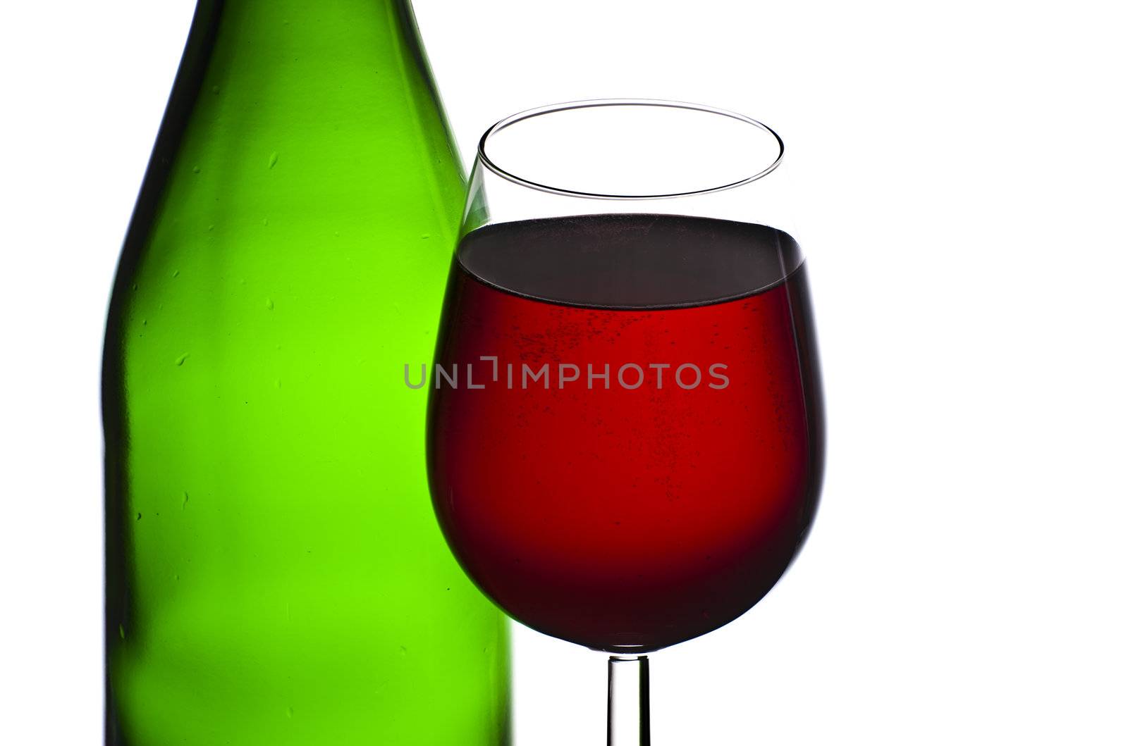 Bottle and glass of red wine isolated on white background by mozzyb