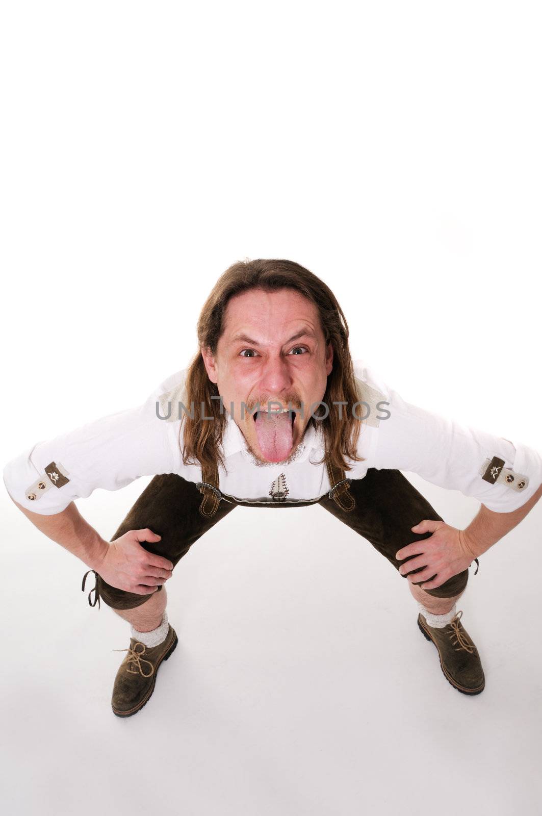 Crazy bavarian man in traditional costume over white background.