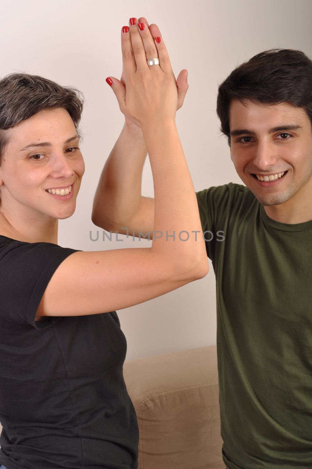 happiness between sister and brother giving each other high five