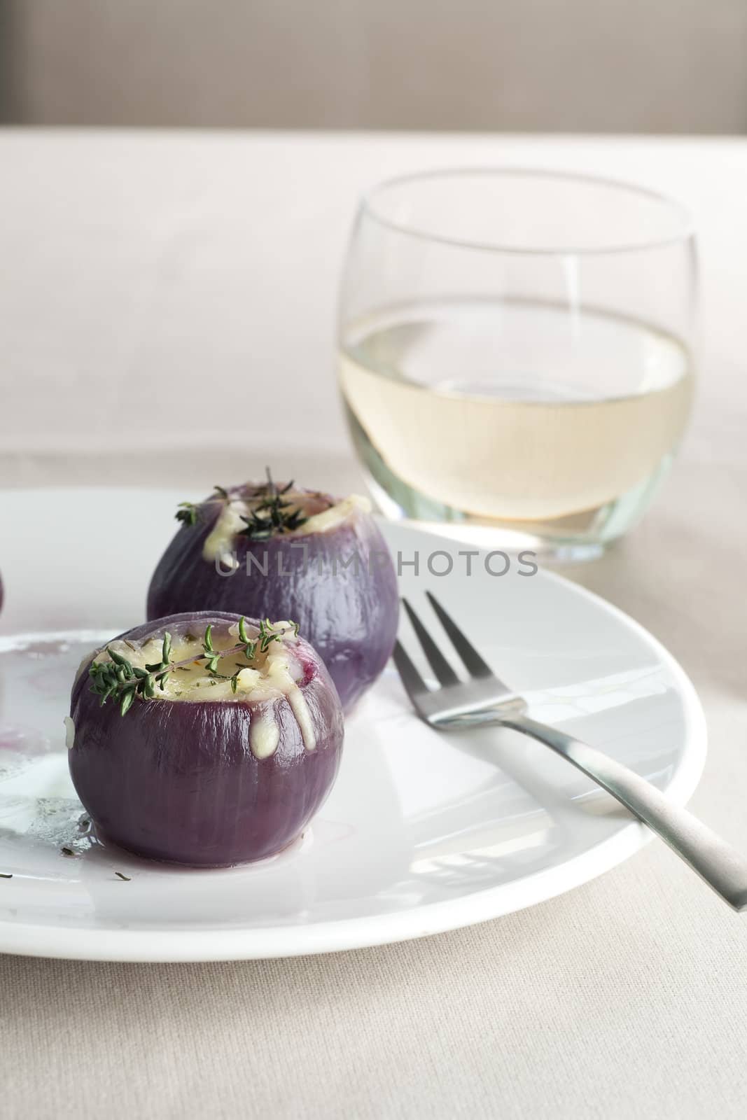 Fresh boiled and stuffed with rice and cheese, seen here with fork and white wine.