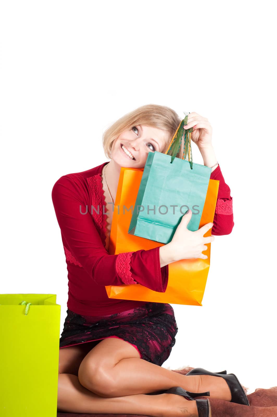Beautiful woman with shopping bags isolated onwhite
