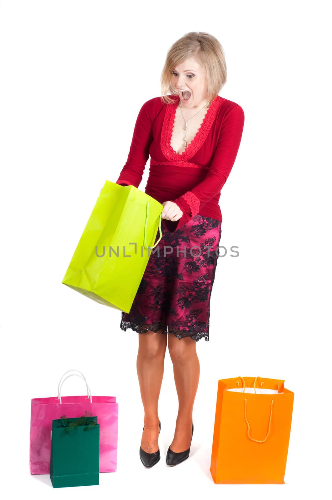 Beautiful woman with shopping bags isolated onwhite