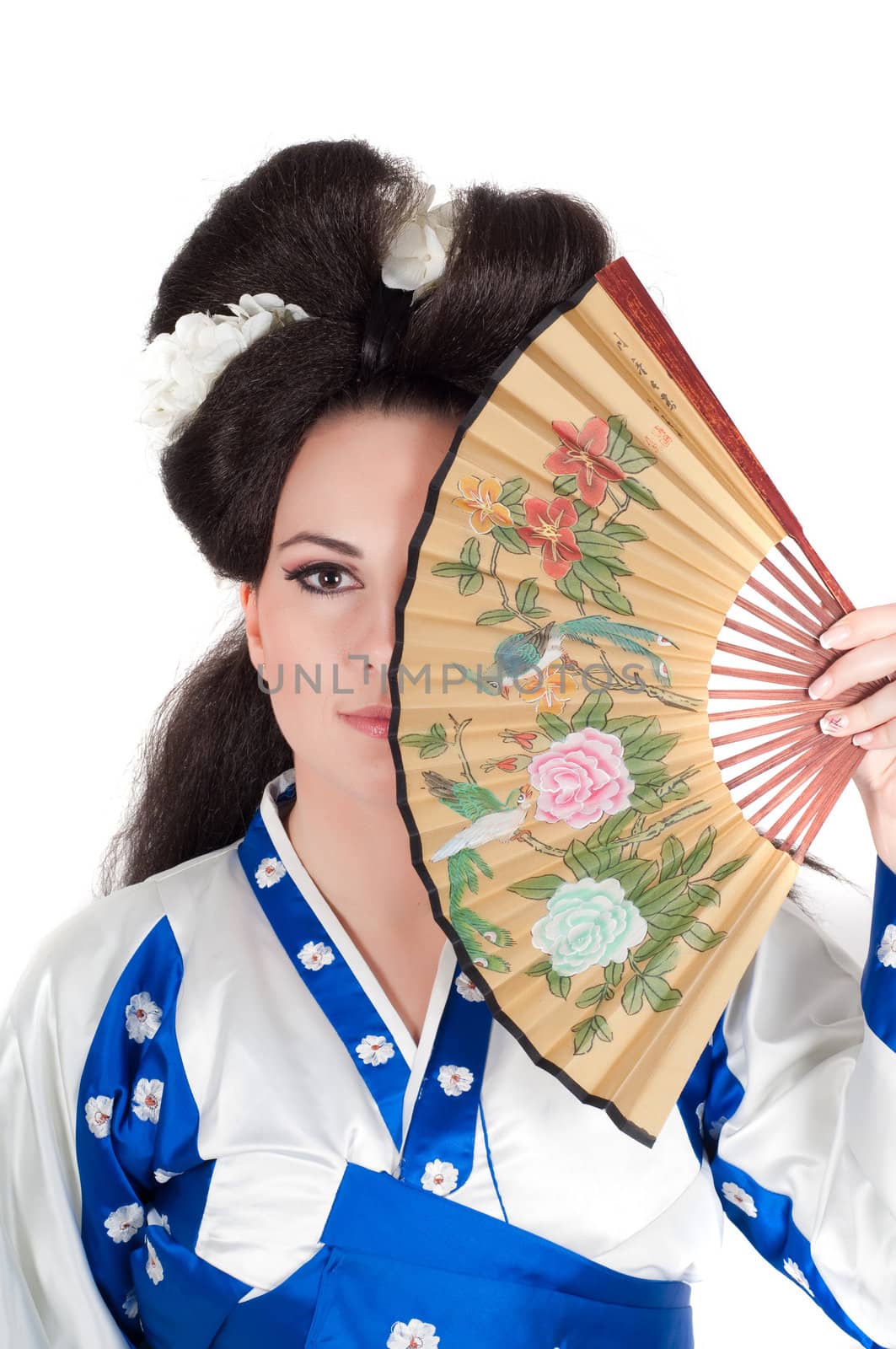 Portrait of the girl of the Asian appearance with a make-up under the geisha on a white background