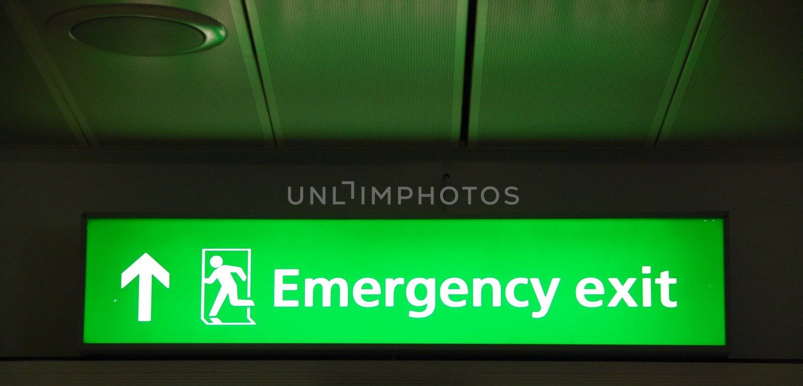 green mergency sign at a international airport