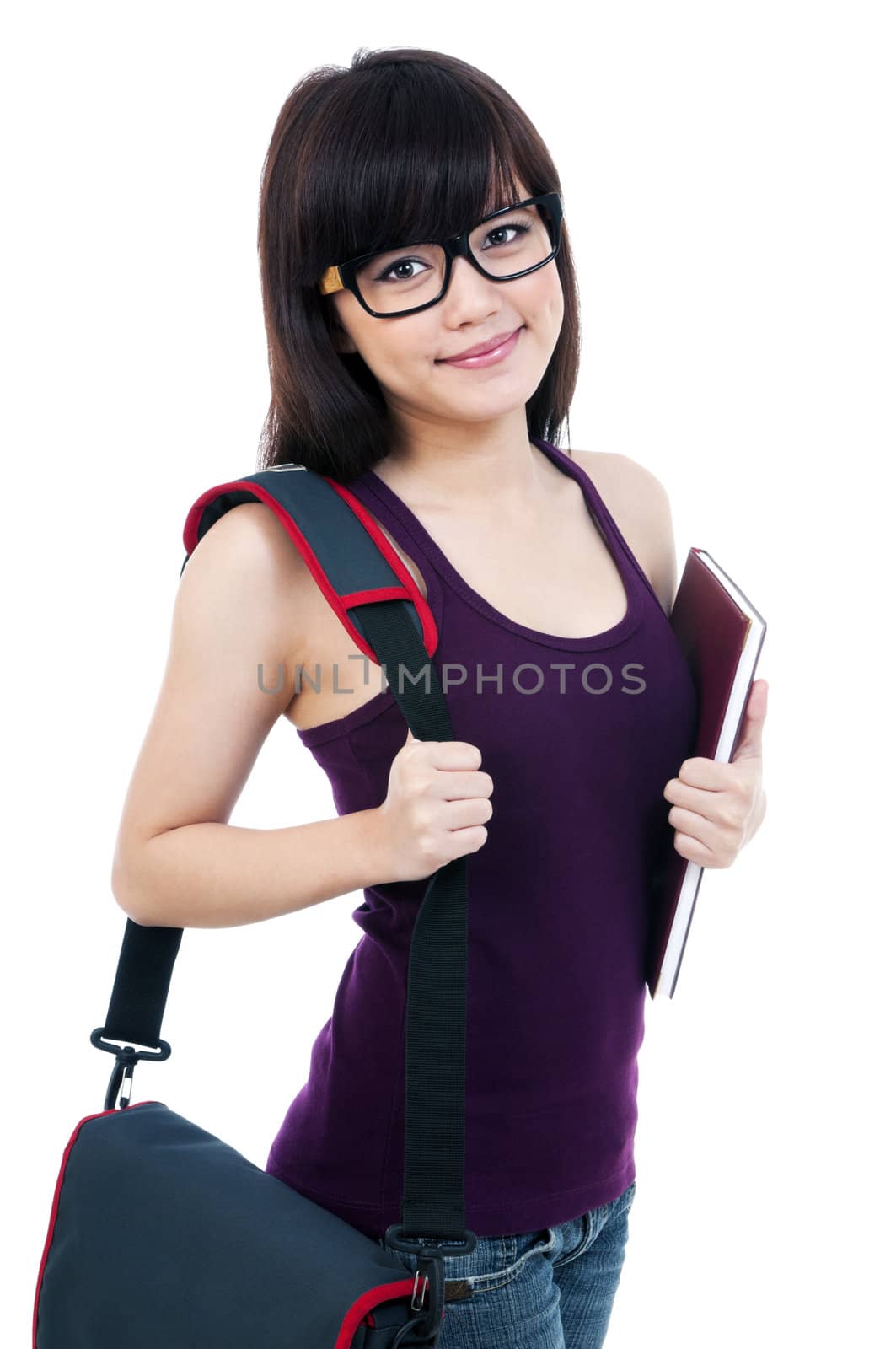 Portrait of a cute young woman holding her book and bag, isolated on white background.