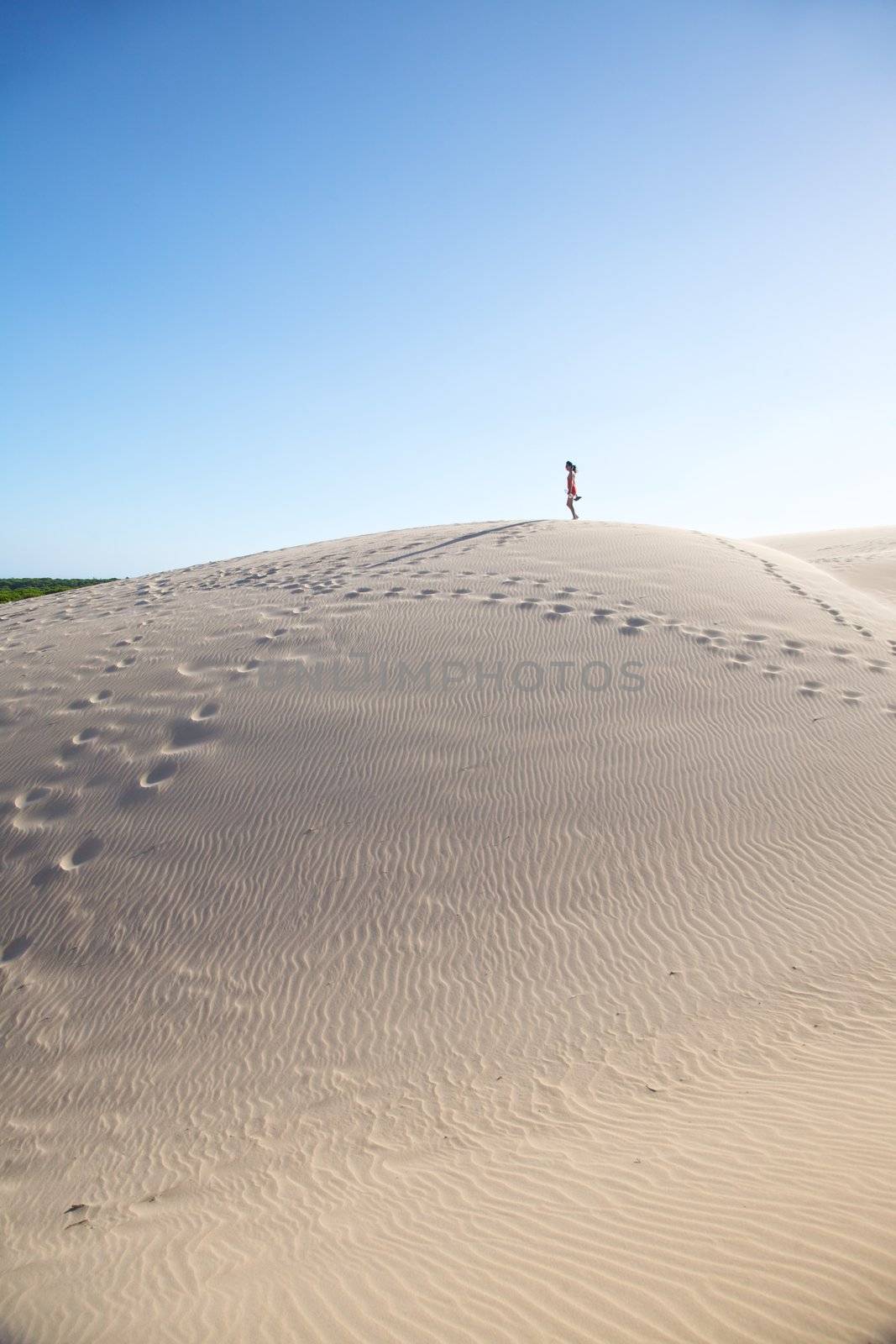 woman on great sand mountain by quintanilla