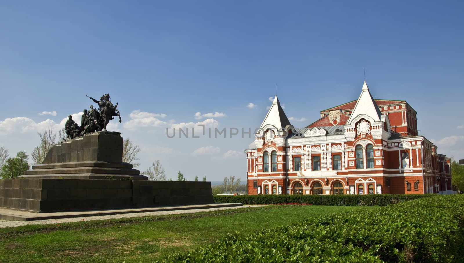 Building of the Drama Theatre, built in traditional Russian style and monument to the cavalry. Urban landscape. Russia, Samara.
