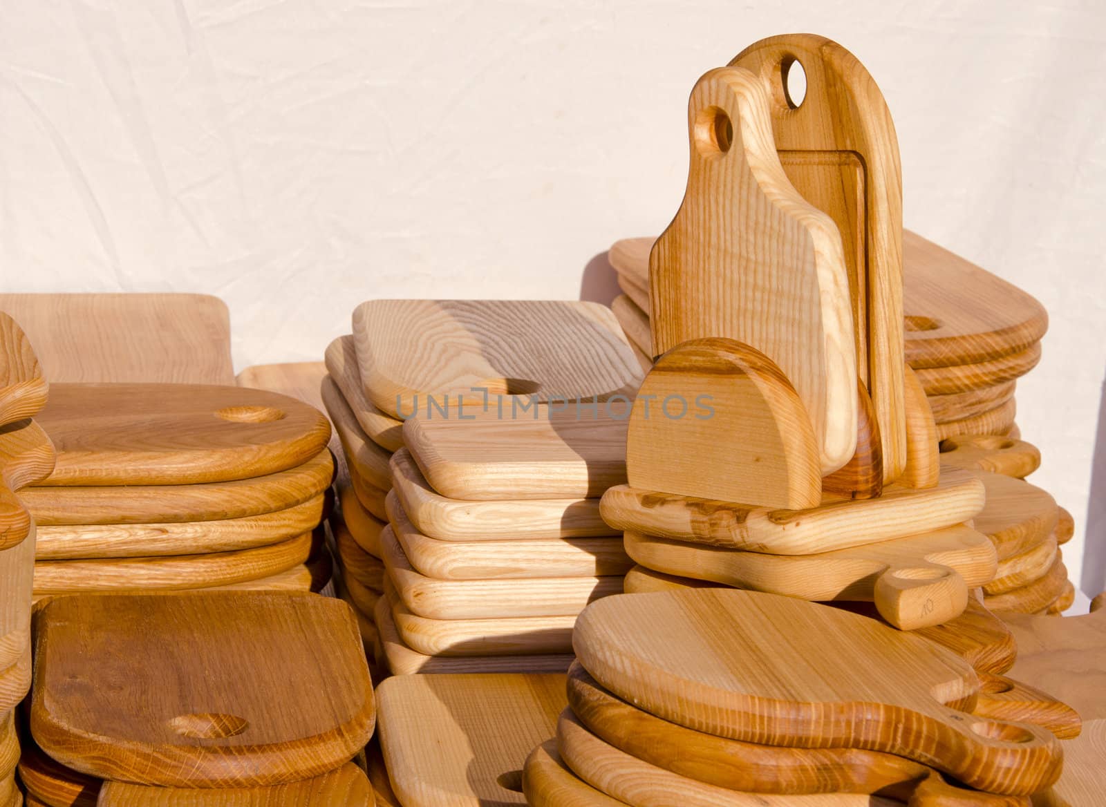 Wooden kitchen cutting boards. Various forms handmade articles made of wood.