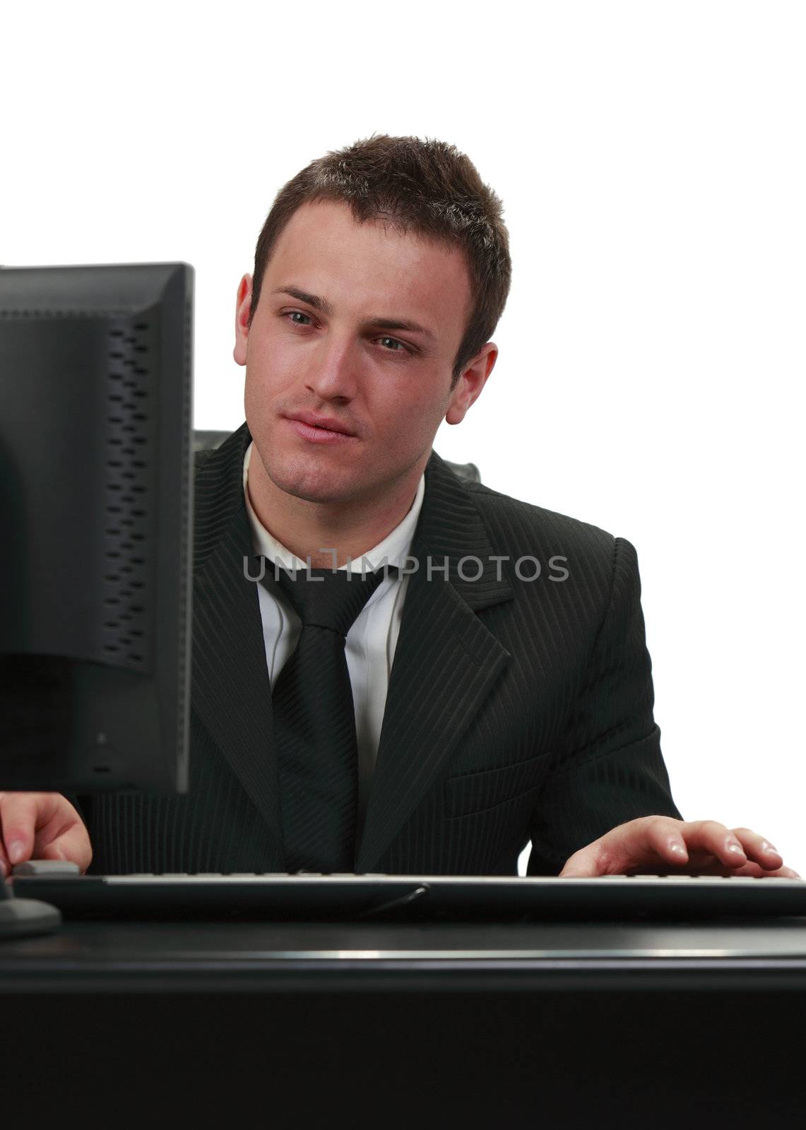 Image of a young businessman working on his computer.