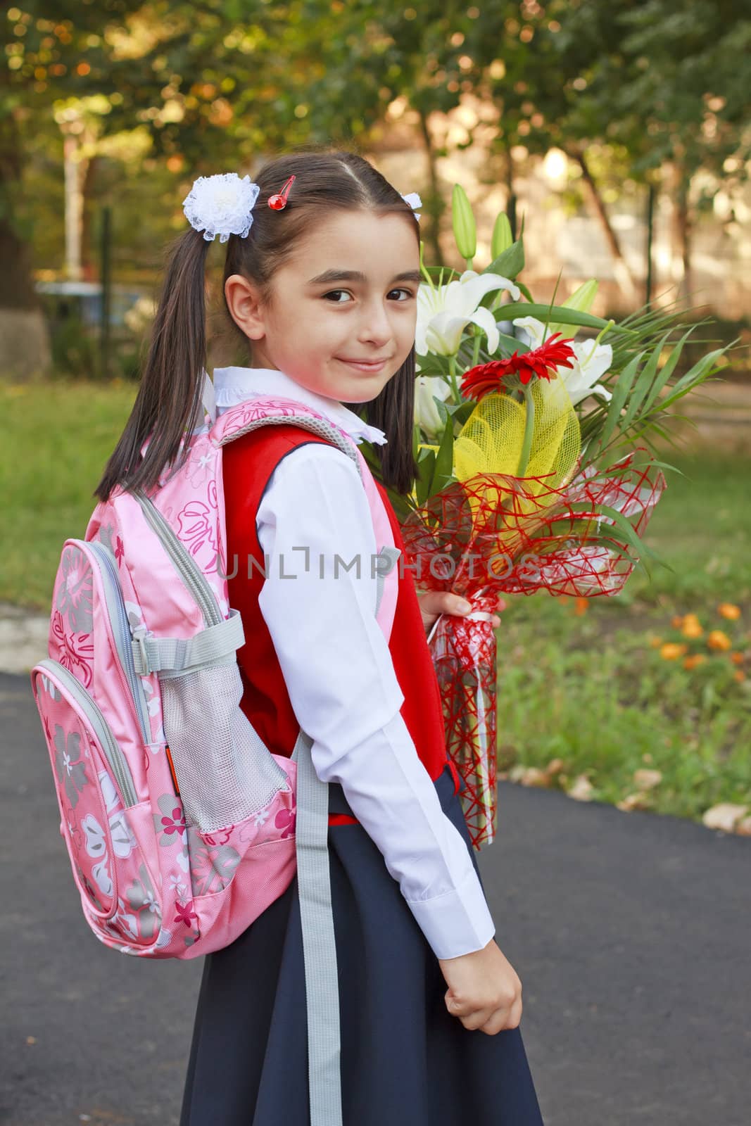 A little girl on her way to school