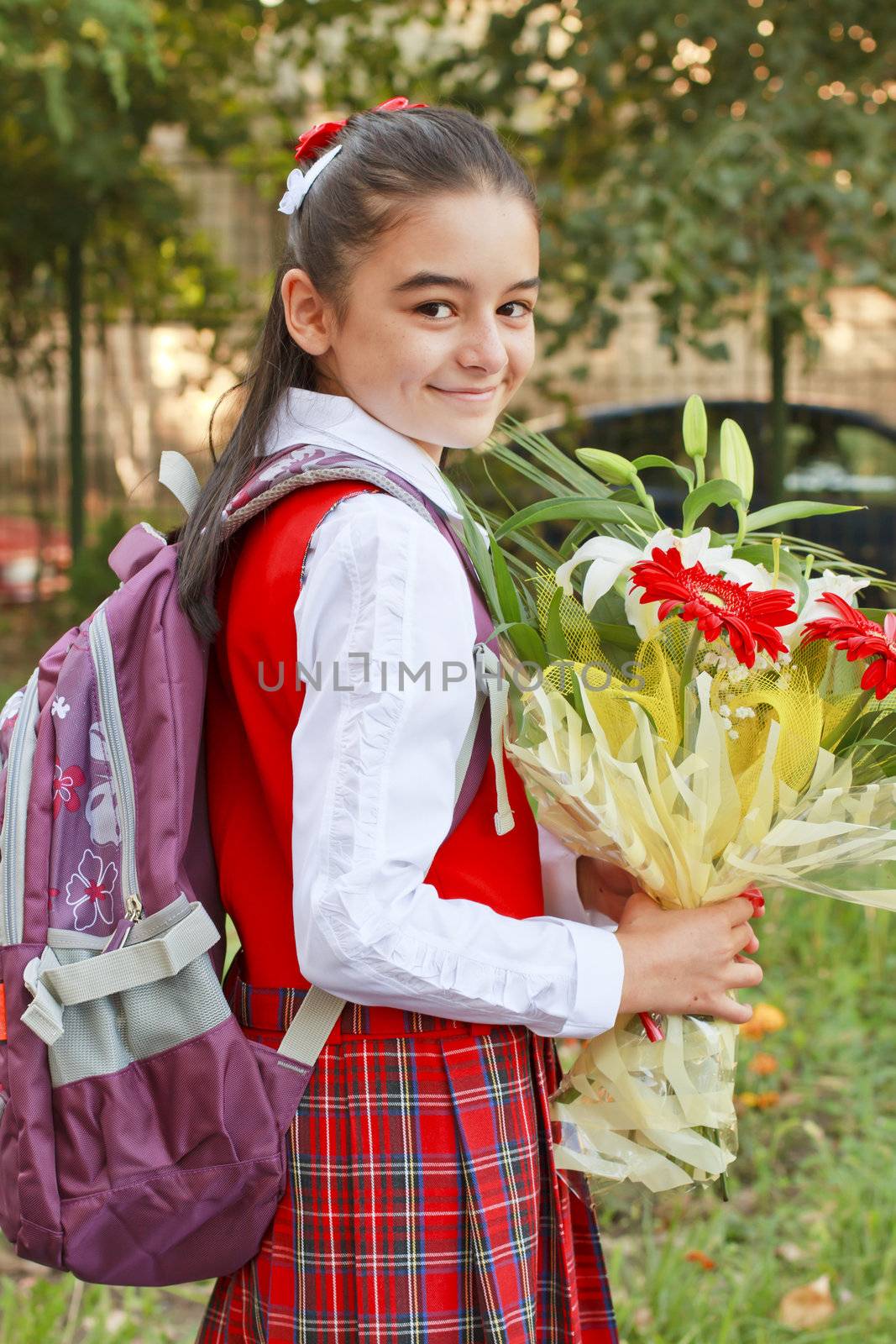 A pretty young girl on her way to school