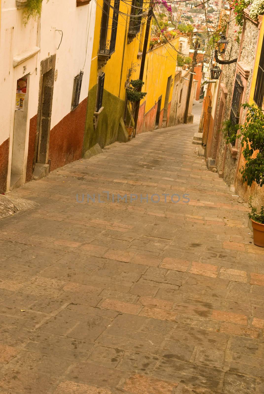 The narrow, hillside  streets of colorful San Miguel Allende Mexico