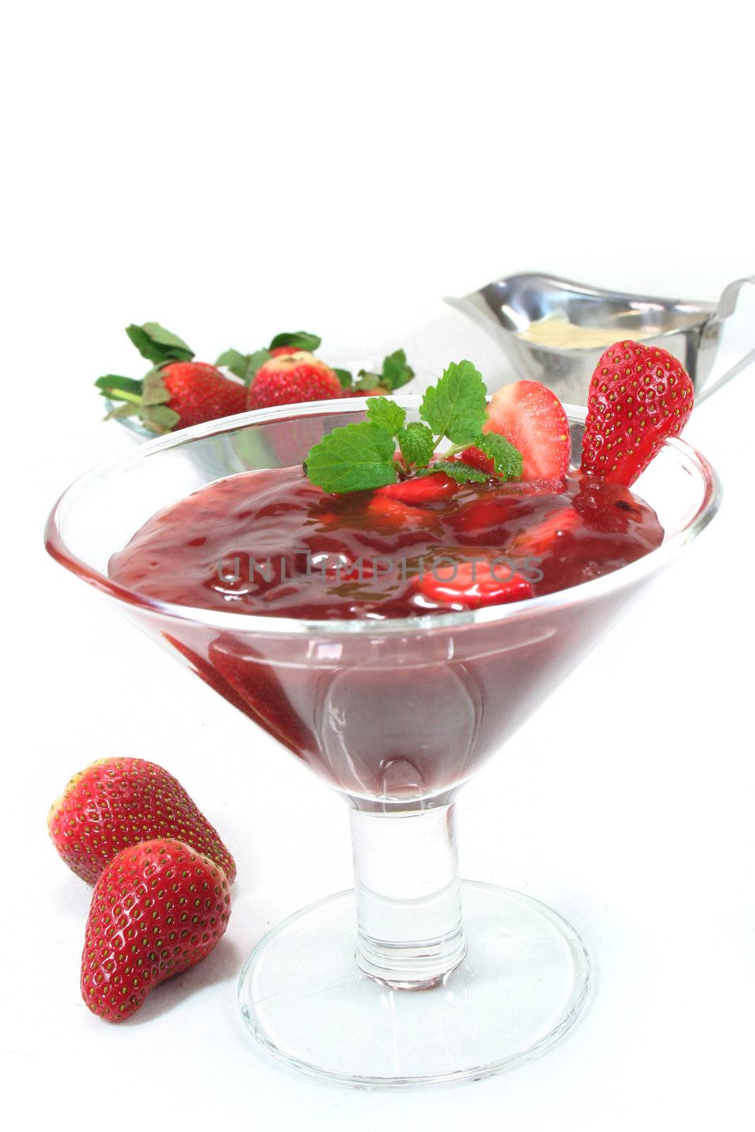 Red fruit jelly with strawberries and lemon balm