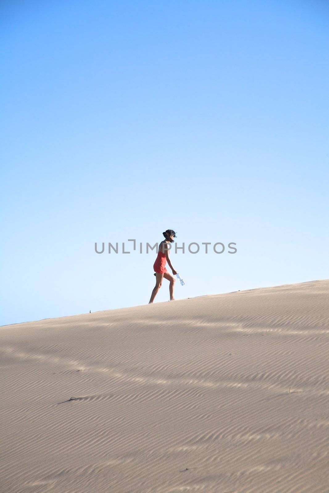 side woman on great sand mountain by quintanilla