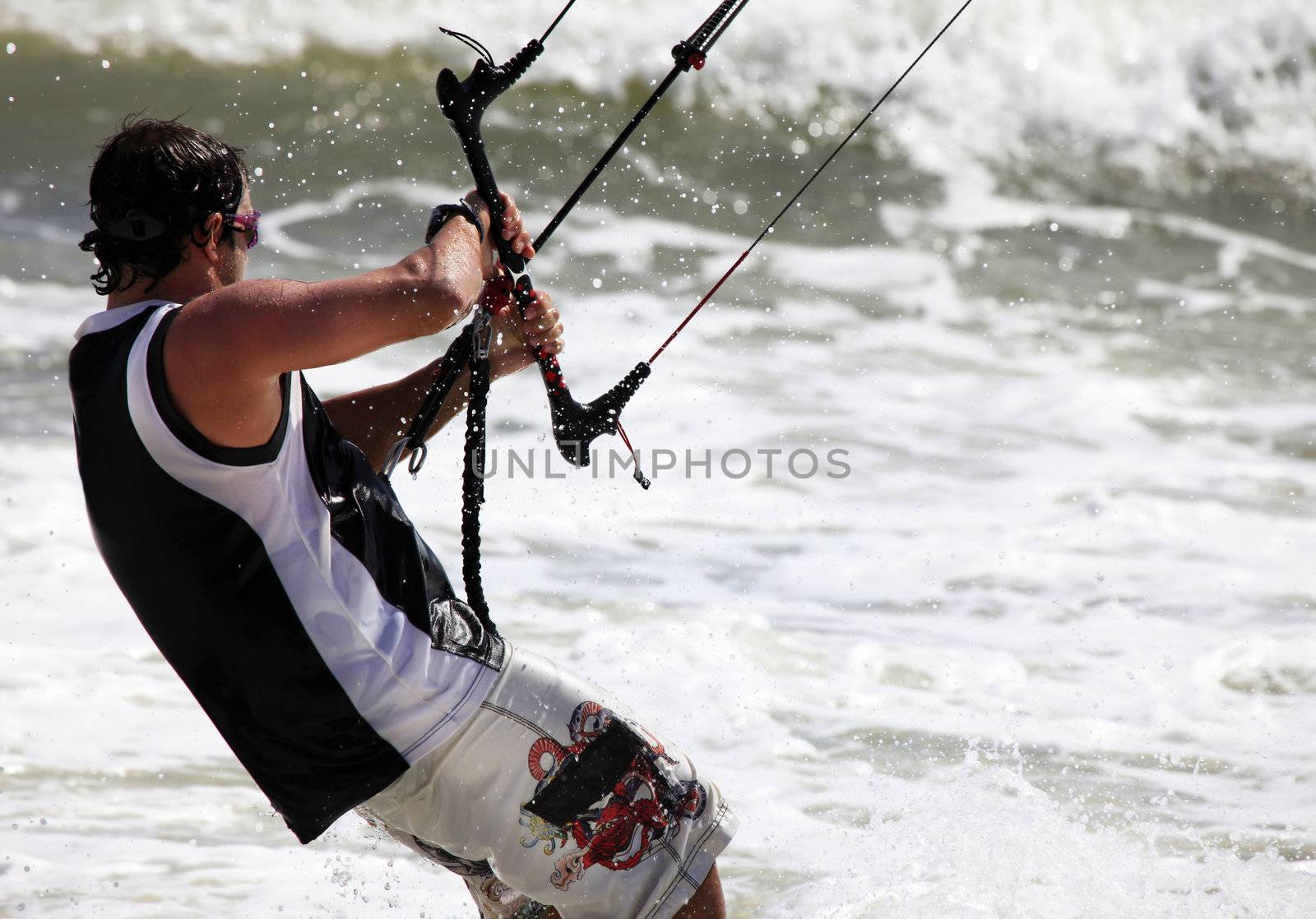 Kiteboarder enjoy surfing in ocean. Vietnam