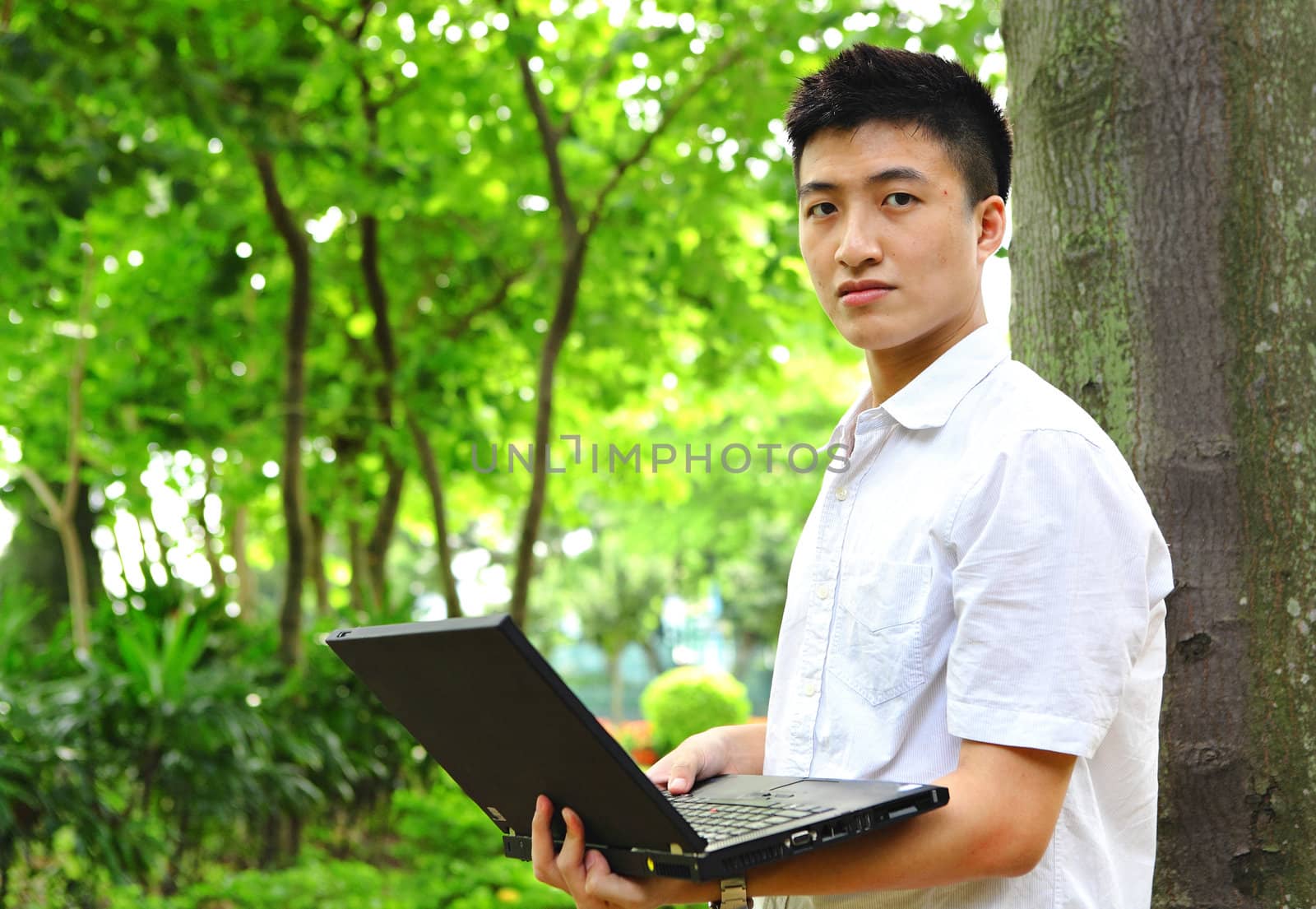 man using computer outdoor