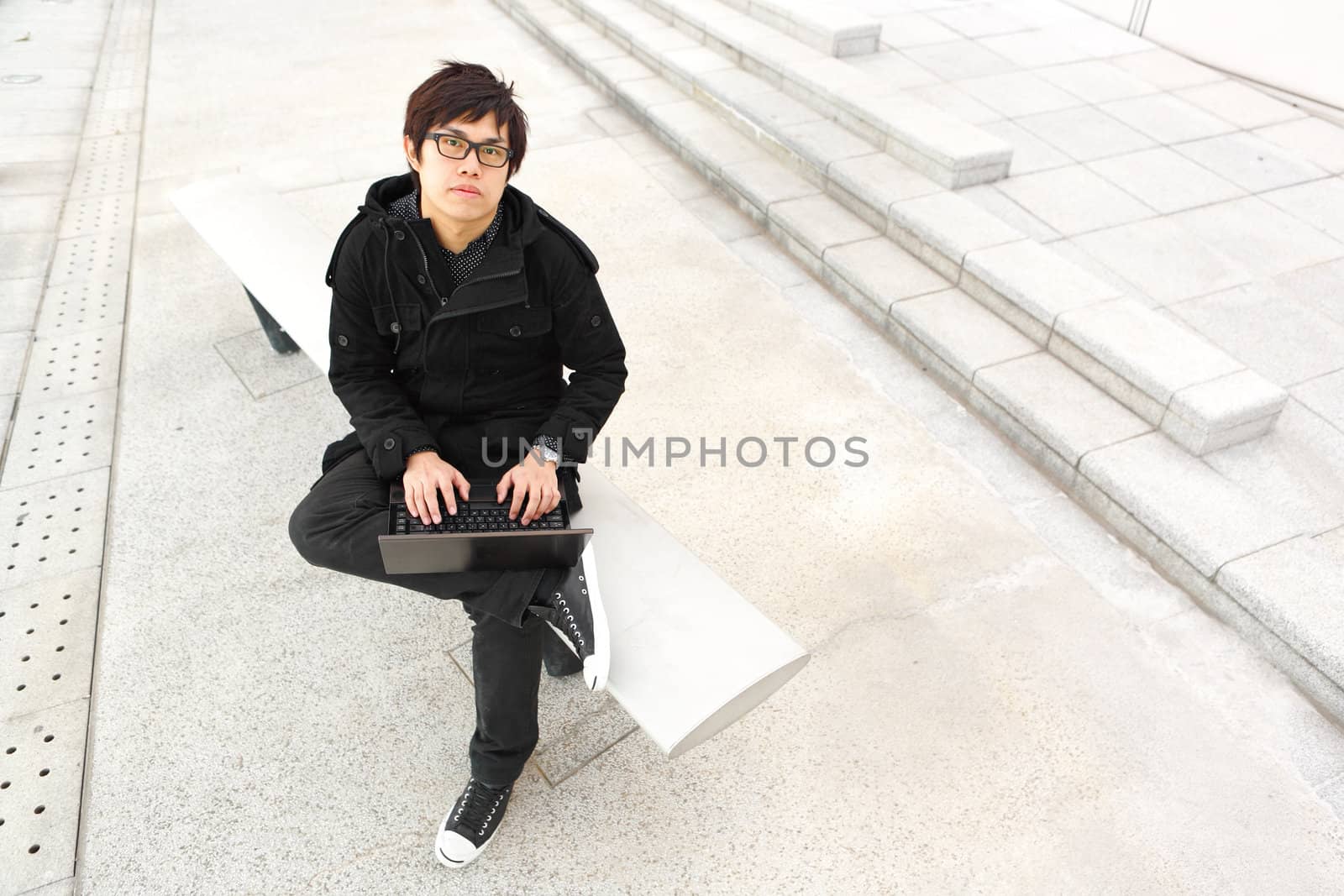 man using computer outdoor