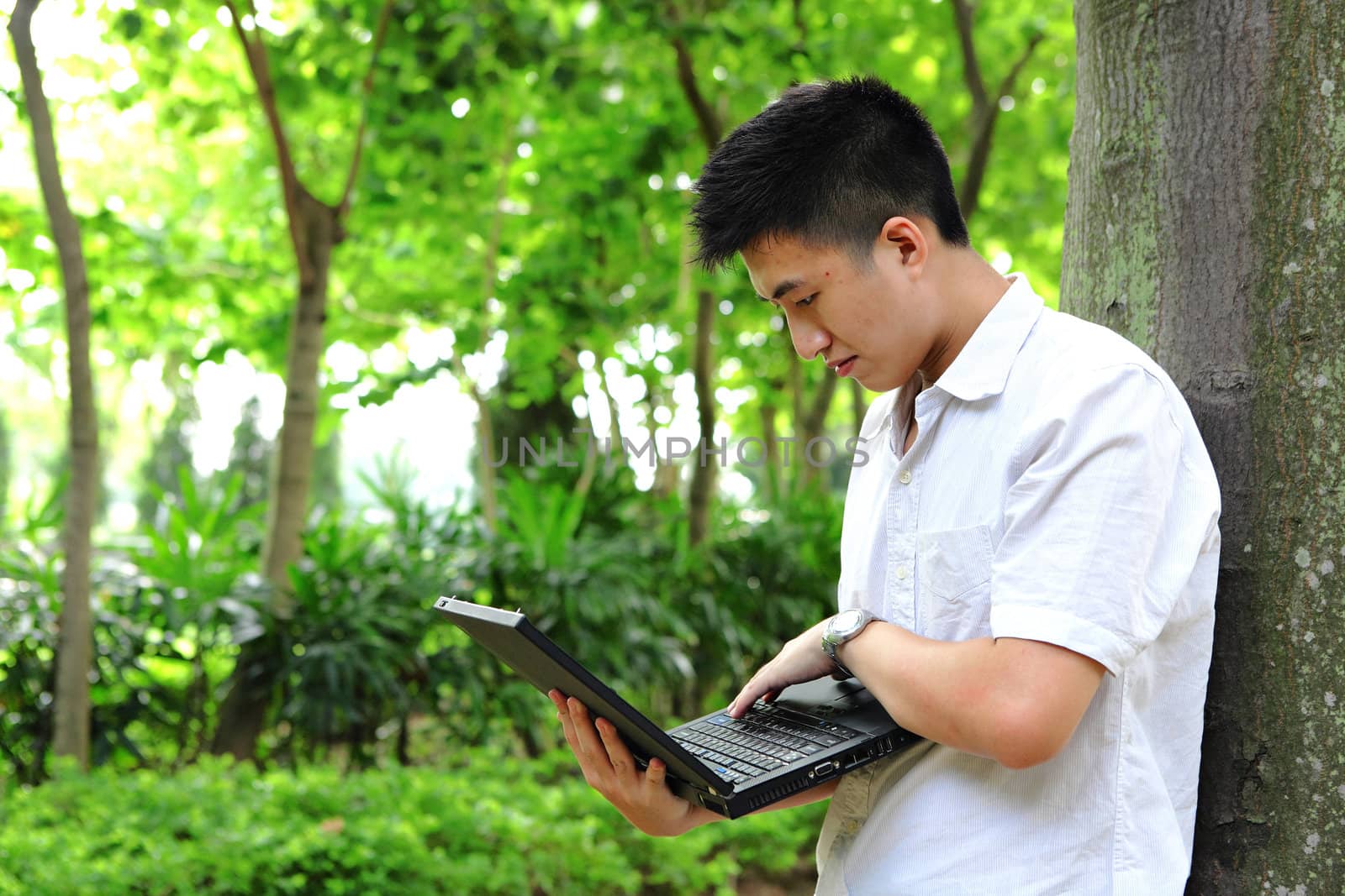 man using computer outdoor