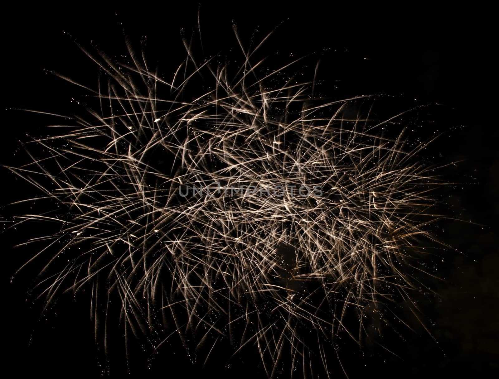 Firework display against black sky