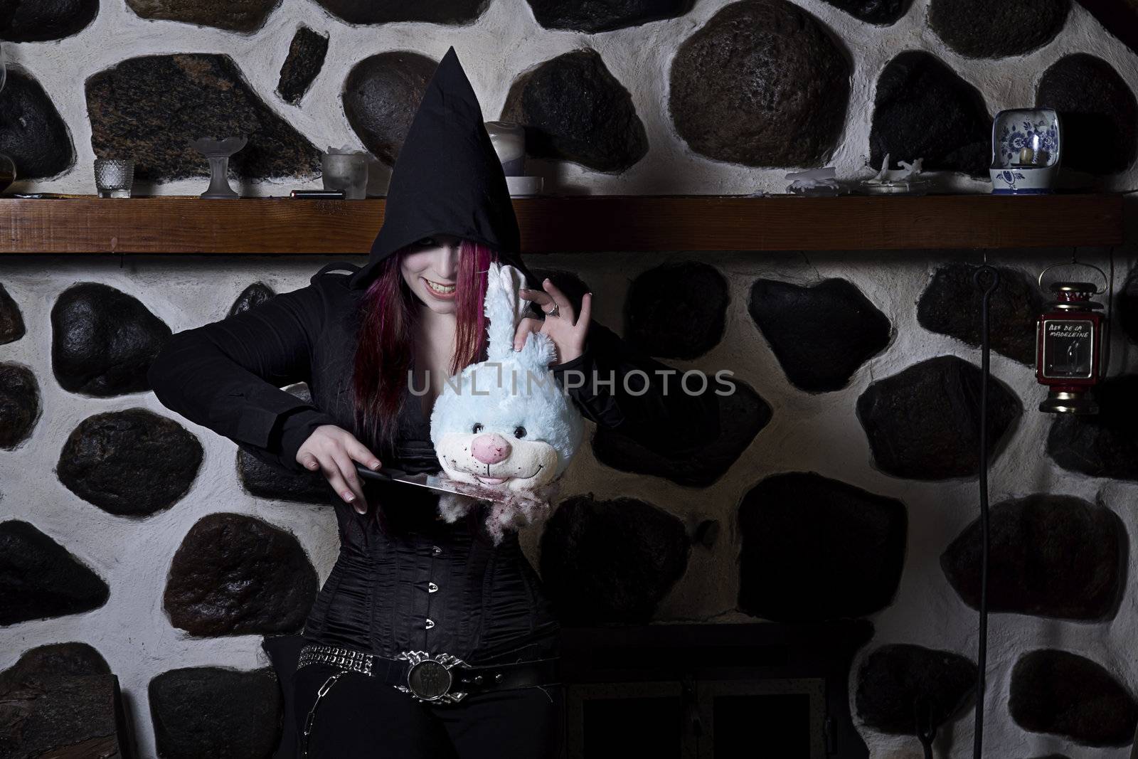 Girl with knife and stuffed bunny head