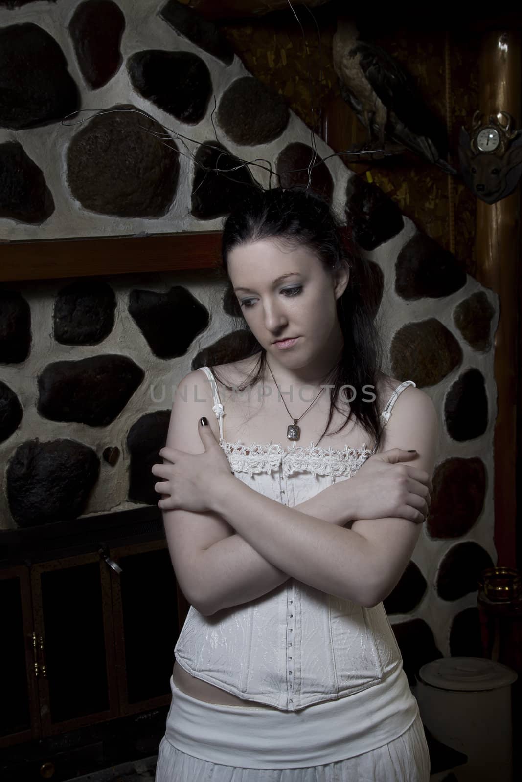 Young woman dress in goth fashion with sad expression