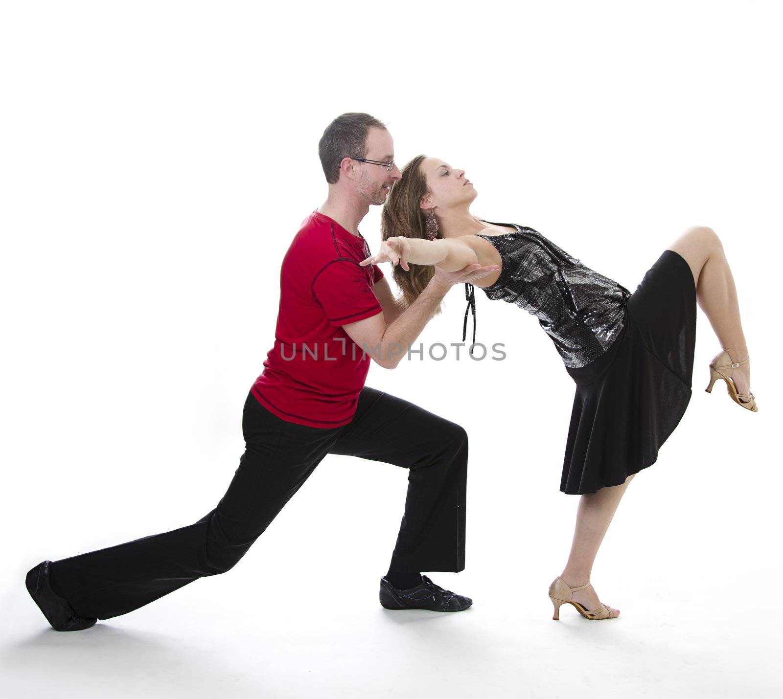 couple dancing salsa in the middle of a pose