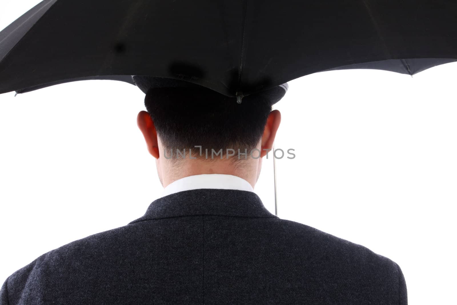 Man with bowler hat and an umbrella in the back