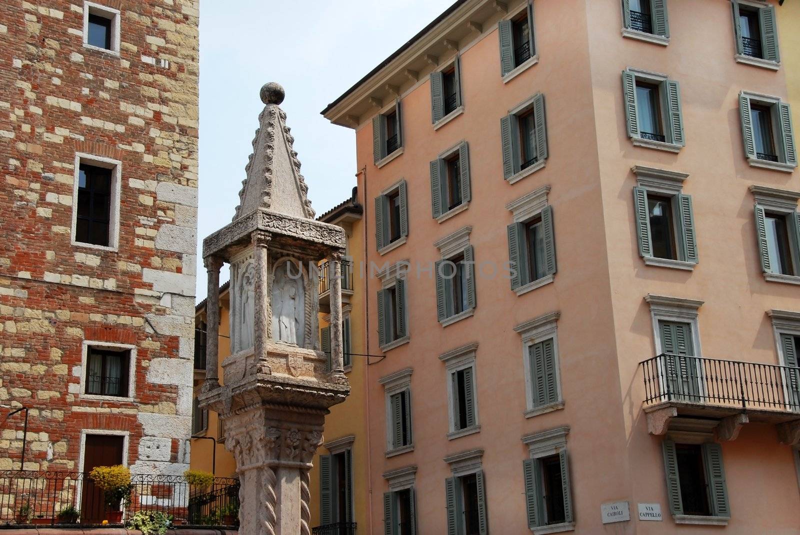 building exterior details and saint statue in Verona, Italy